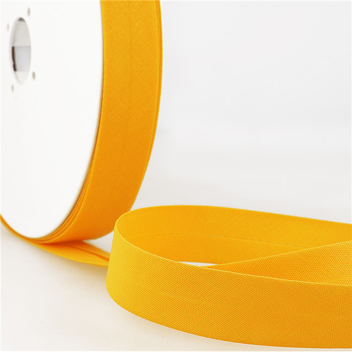 Biais étroit 20mm écru/orange au mètre Biais étroit 20mm écru/orange au mètre