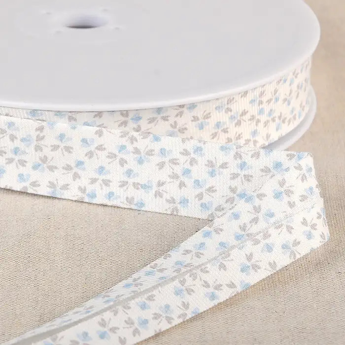 Biais fleurs bleu 20mm au mètre Biais fleurs bleu 20mm au mètre