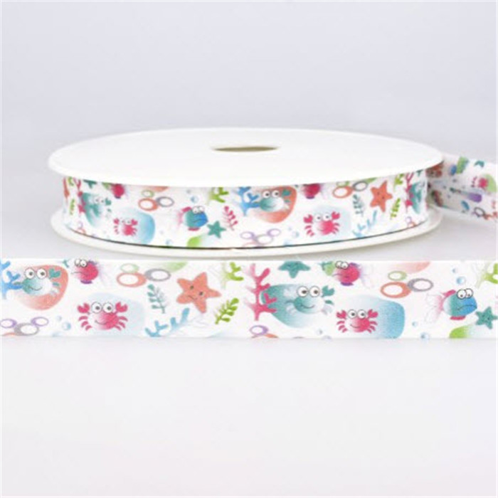Biais plié blanc motif océan 20mm /m Biais plié blanc motif océan 20mm /m