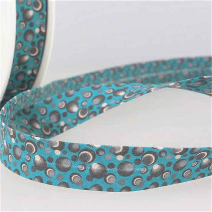 Biais plié bleu canard motif bulles 20mm /m Biais plié bleu canard motif bulles 20mm /m