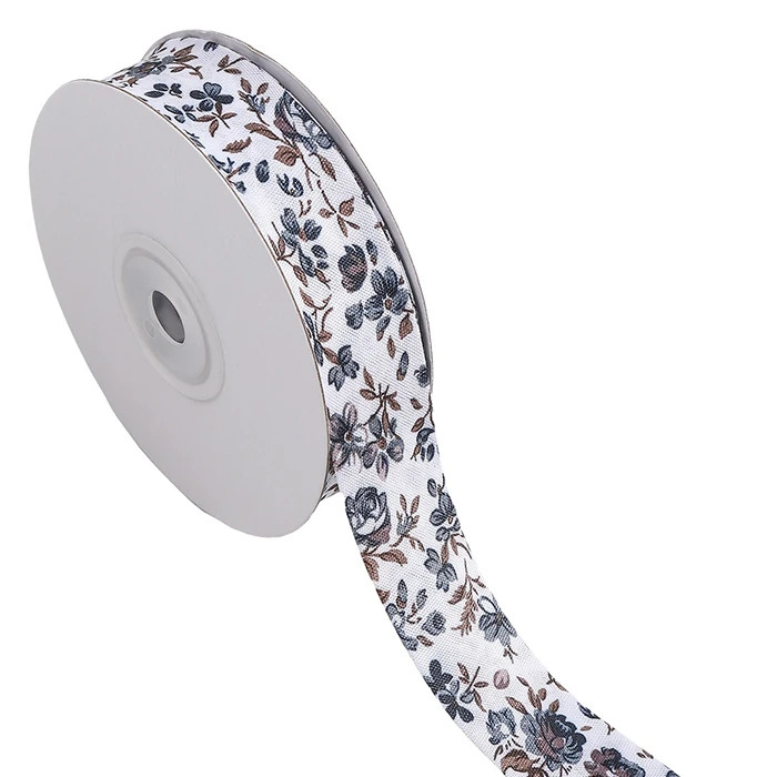 Biais replié 25mm blanc à fleurs grises /m Biais replié 25mm blanc à fleurs grises /m