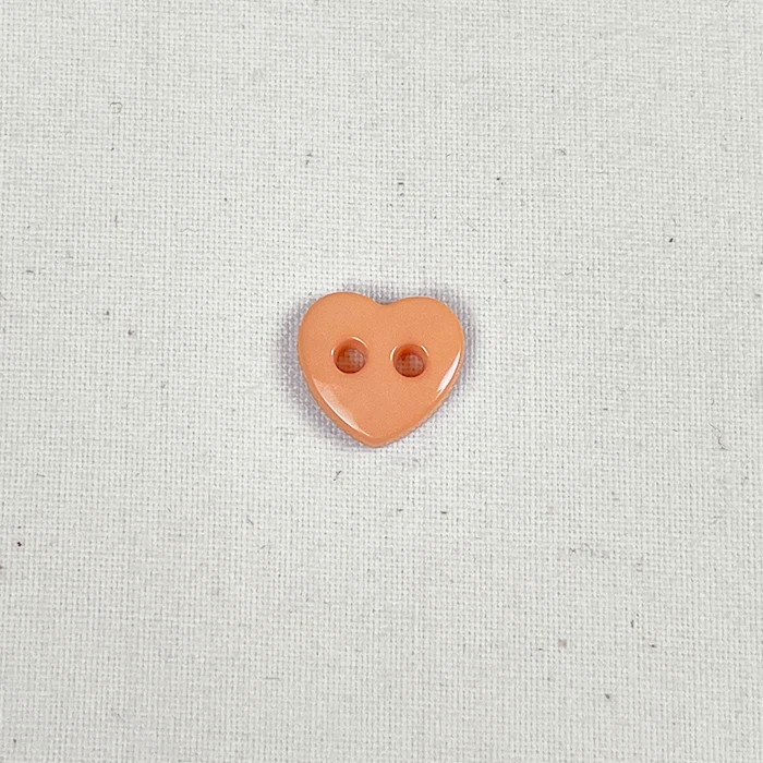 Bouton 12mm forme de coeur corail uni Bouton 12mm forme de coeur corail uni