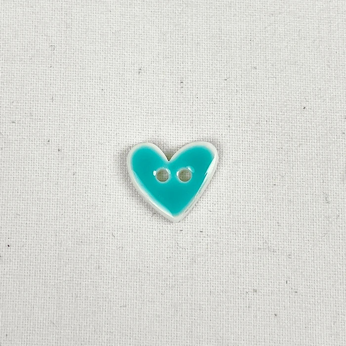 Bouton 15mm forme de coeur bleu turquoise effet émail Bouton 15mm forme de coeur bleu turquoise effet émail