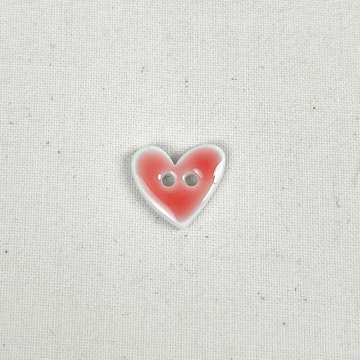 Bouton 15mm forme de coeur corail effet émail Bouton 15mm forme de coeur corail effet émail