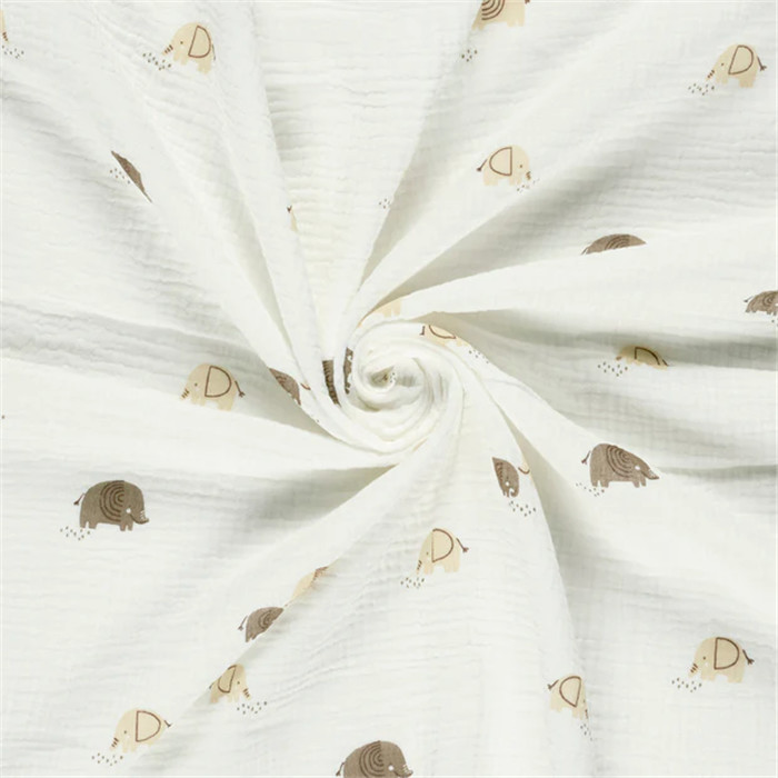 Tissu double gaze de coton éléphants Blanc cassé/ 50cm Tissu double gaze de coton éléphants Blanc cassé/ 50cm